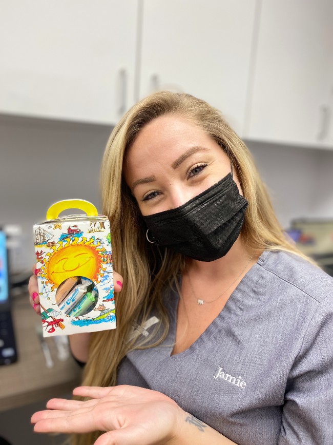 Nurse holding gift box