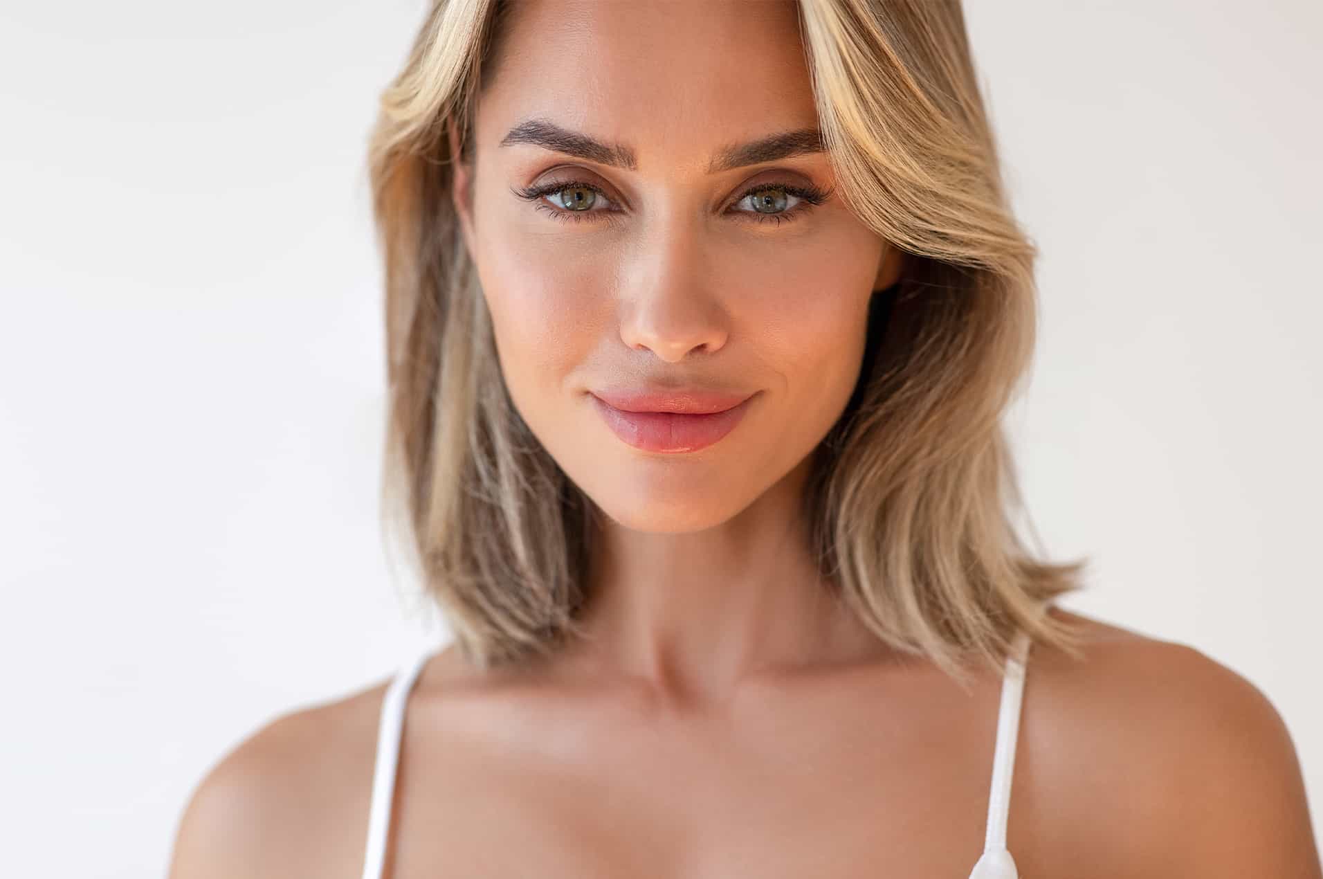 Smiling woman in white top